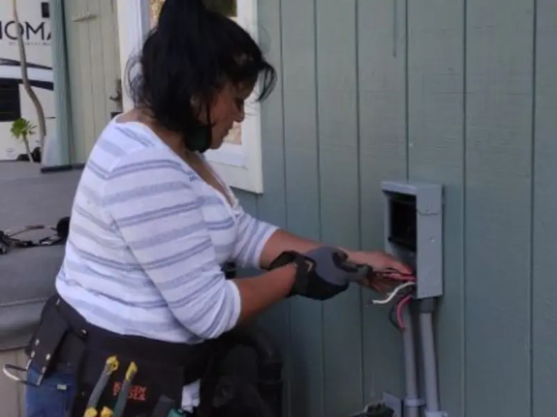 Licensed electrician wiring an exterior subpanel in Cincinnati