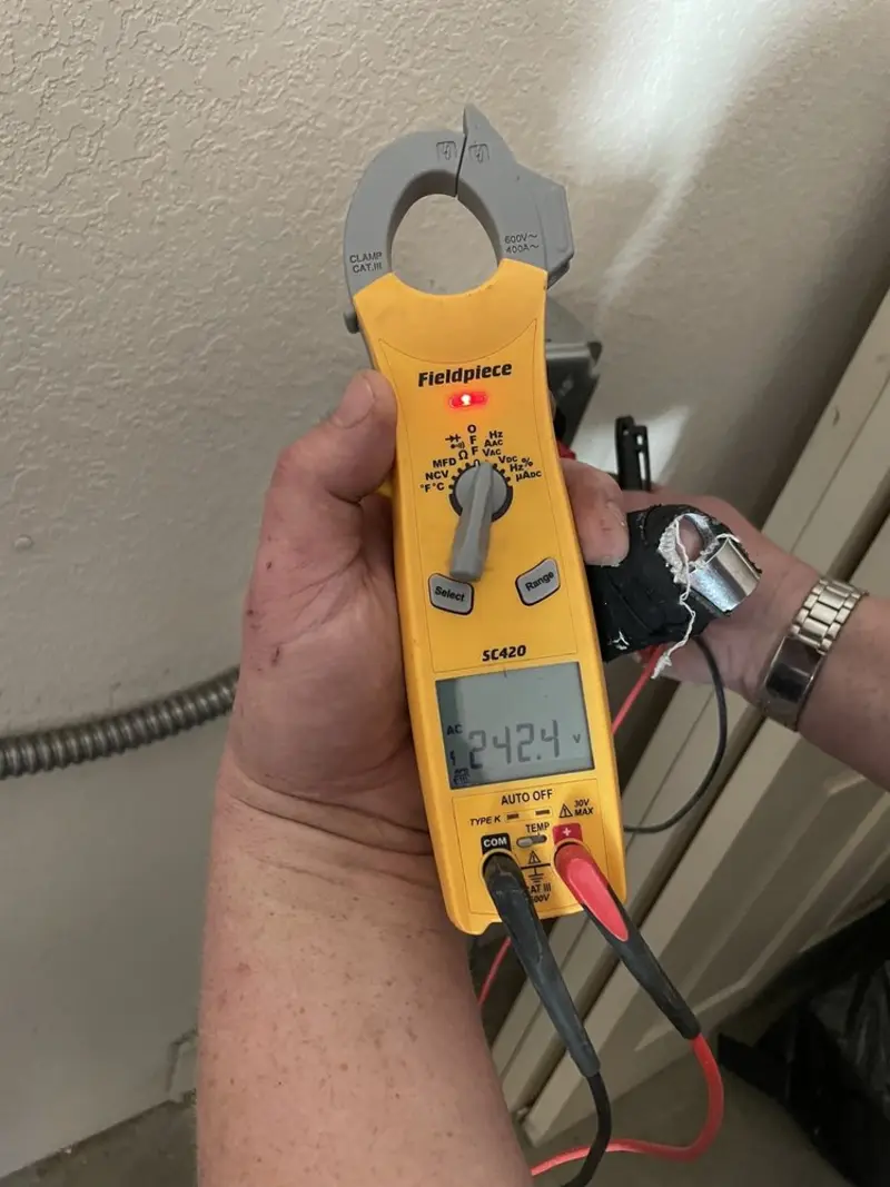 Voltage testing with clamp meter during Outlet Installation in Cincinnati